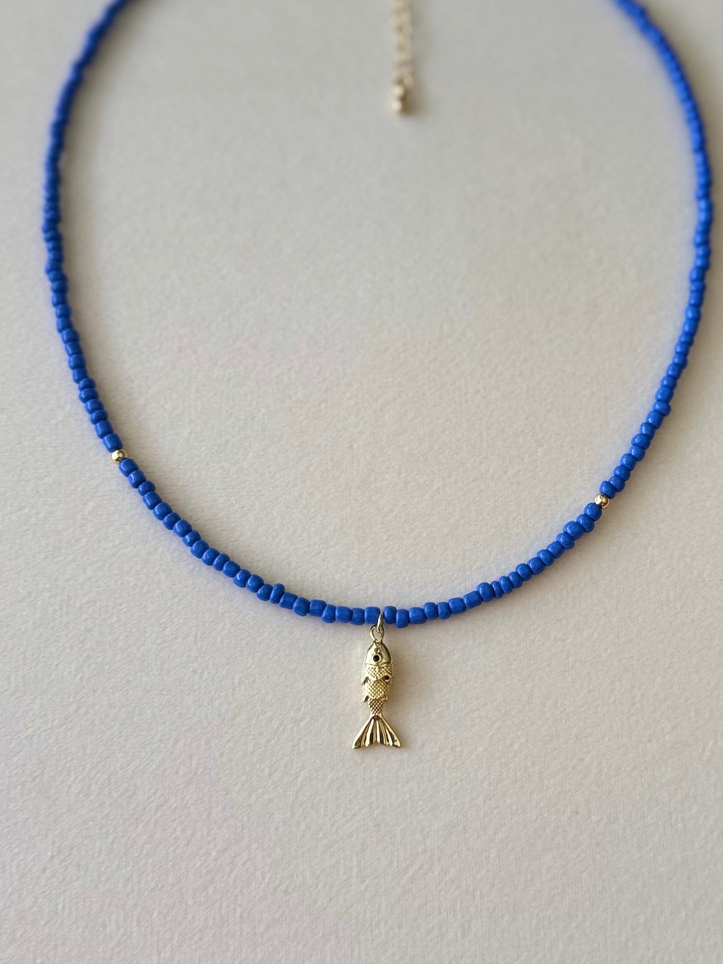 Gold fish necklace