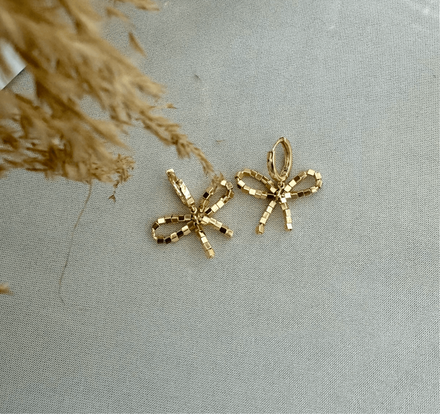 Beaded bow huggie - GOLDEN HOUR studio