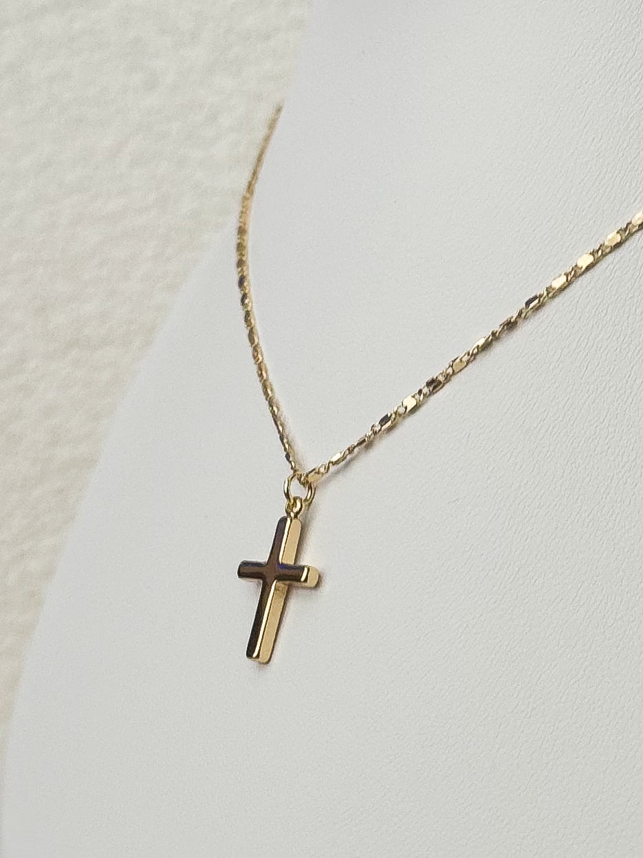 Mini gold cross necklace