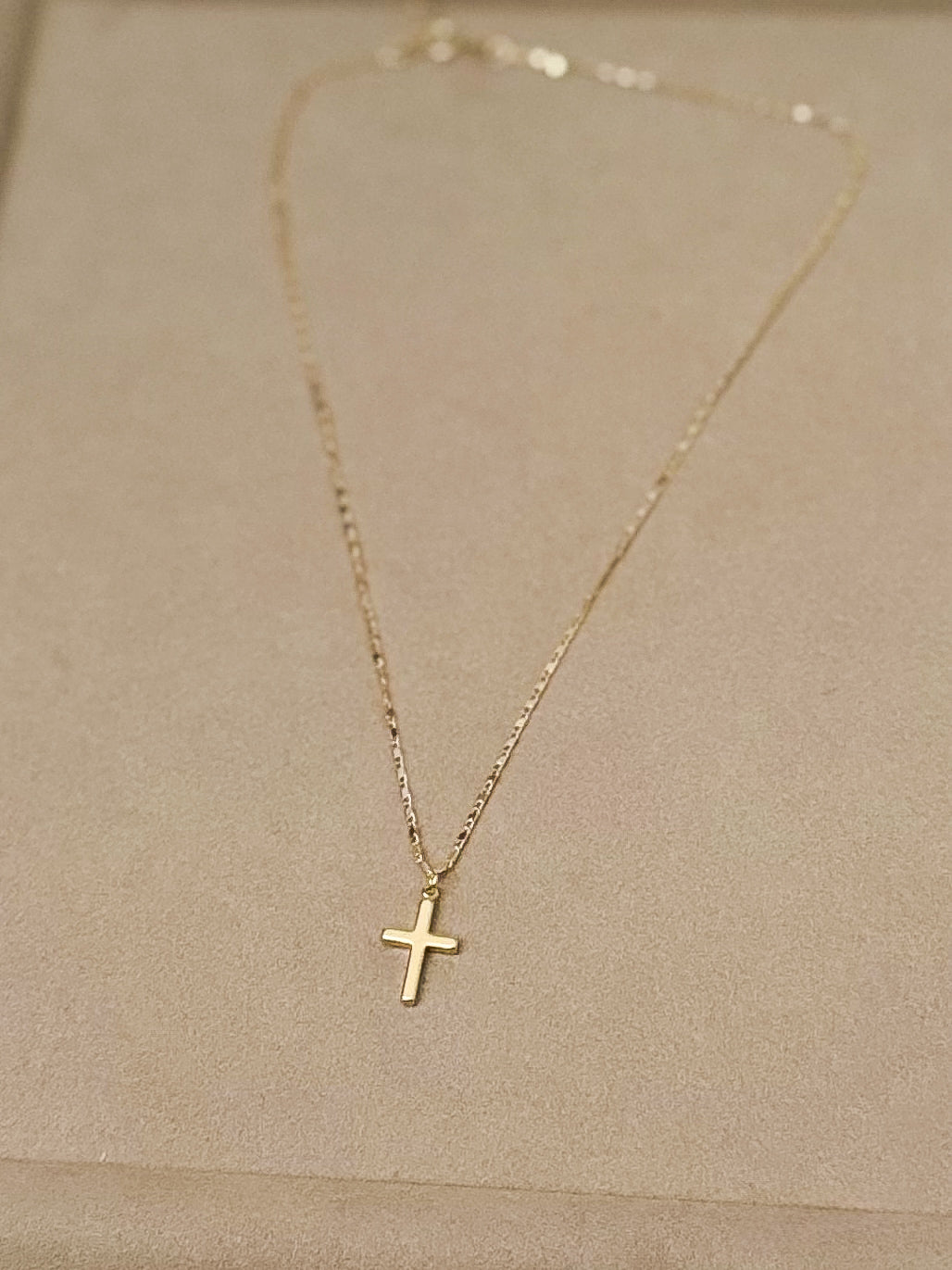 Mini gold cross necklace