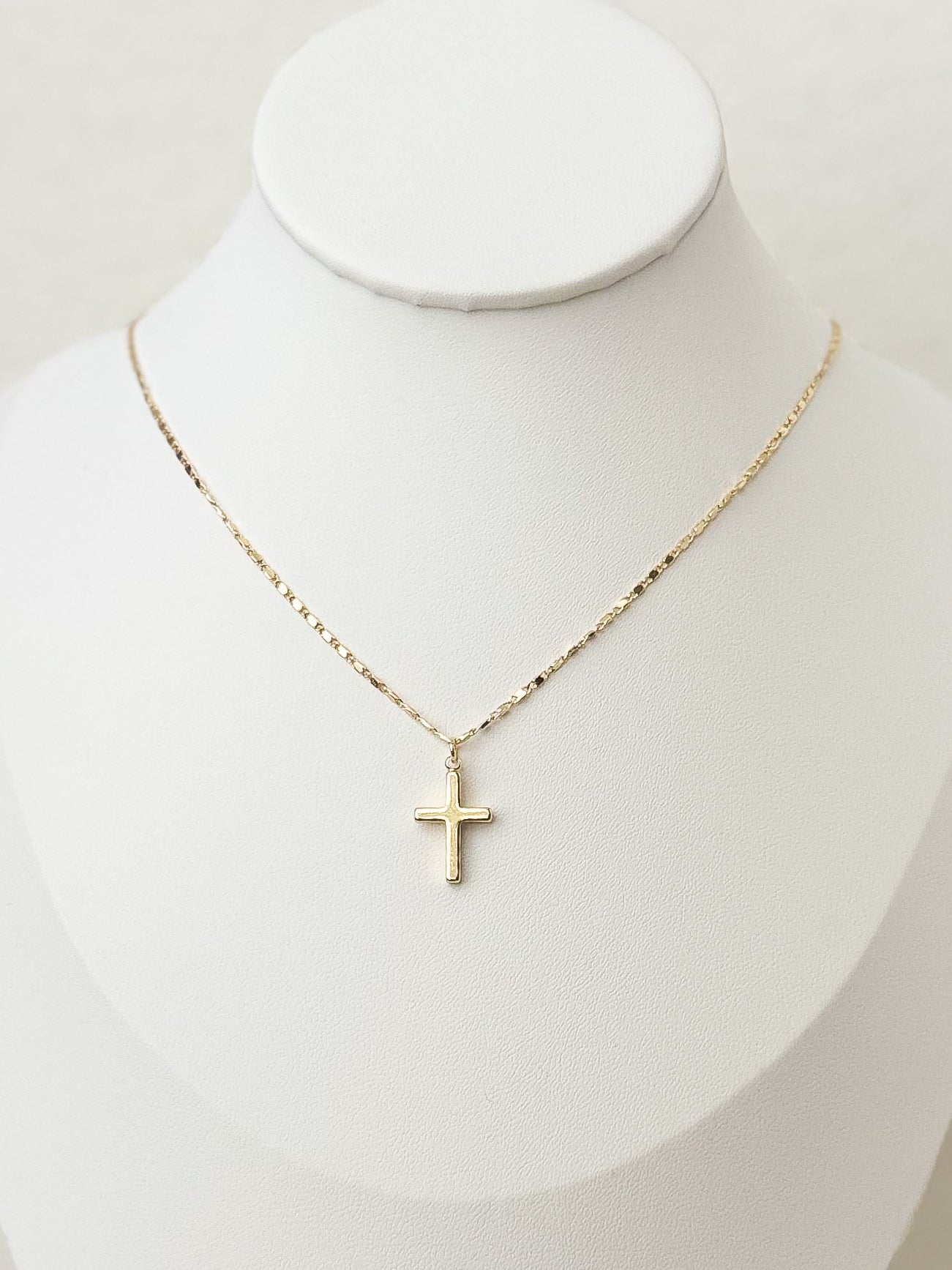 Mini gold cross necklace