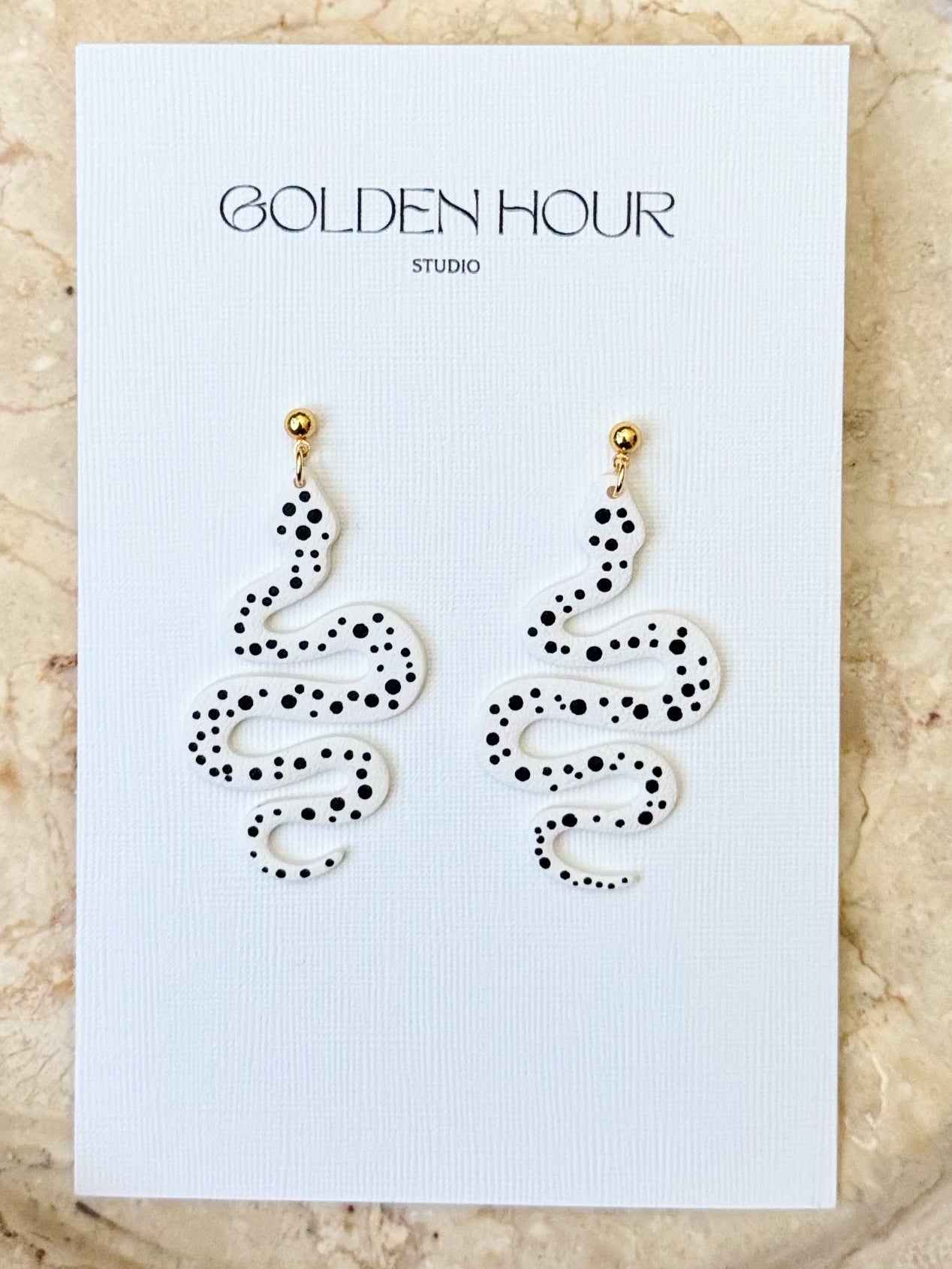 Polka dot snake earrings